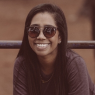 Young woman in sunglasses smiling