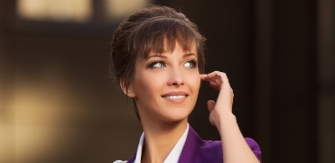 Smiling woman in purple jacket