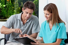 : Patient talking to a dentist about money