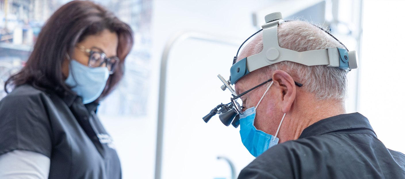 Mercerville dentist and assistant treating a patient