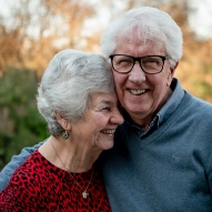 Senior man and woman smiling together outdoors