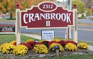 Red sign outside of Mercerville dental office that says Cranbrook I I