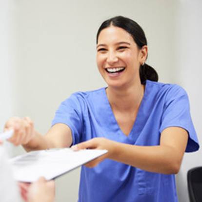 Nurse handing patient insurance form. 