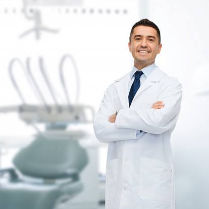 Male dentist smiling