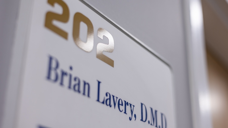 Close up of wall sign that reads 202 Brian Lavery D M D