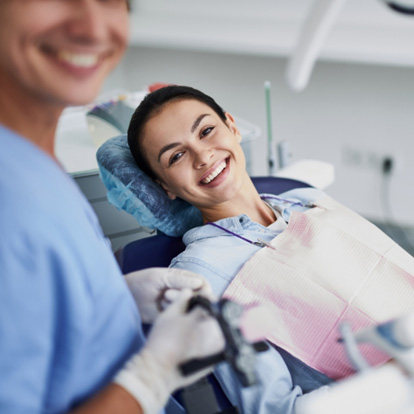 Young woman visiting the dentist’s office for a checkup 