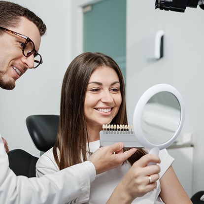 a patient selecting their veneers with their dentist