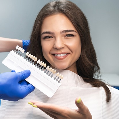 a patient smiling while getting veneers