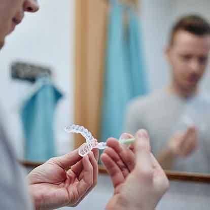 a man having his teeth examined by a dentist