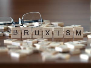 Wooden tiles spelling out bruxism